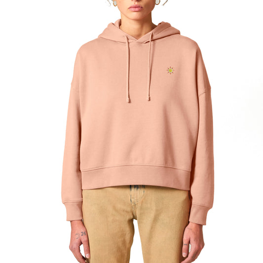 Hoodie für Damen in peach mit gesticktem Sonnen-Motiv auf der Brust.